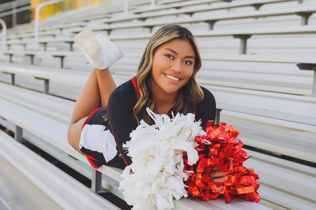 Austin Texas cheerleading prop photos on football field senior by Keala Jarvis Photography