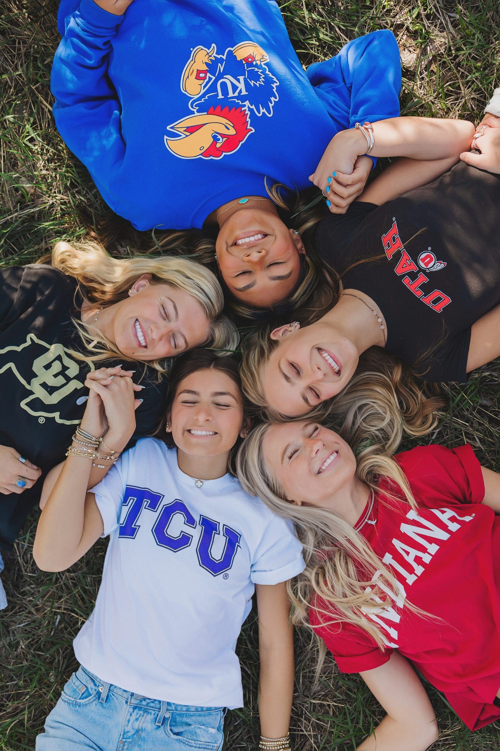 College Gear Announcement photo with friends by Austin Texas Senior Photography Keala Jarvis