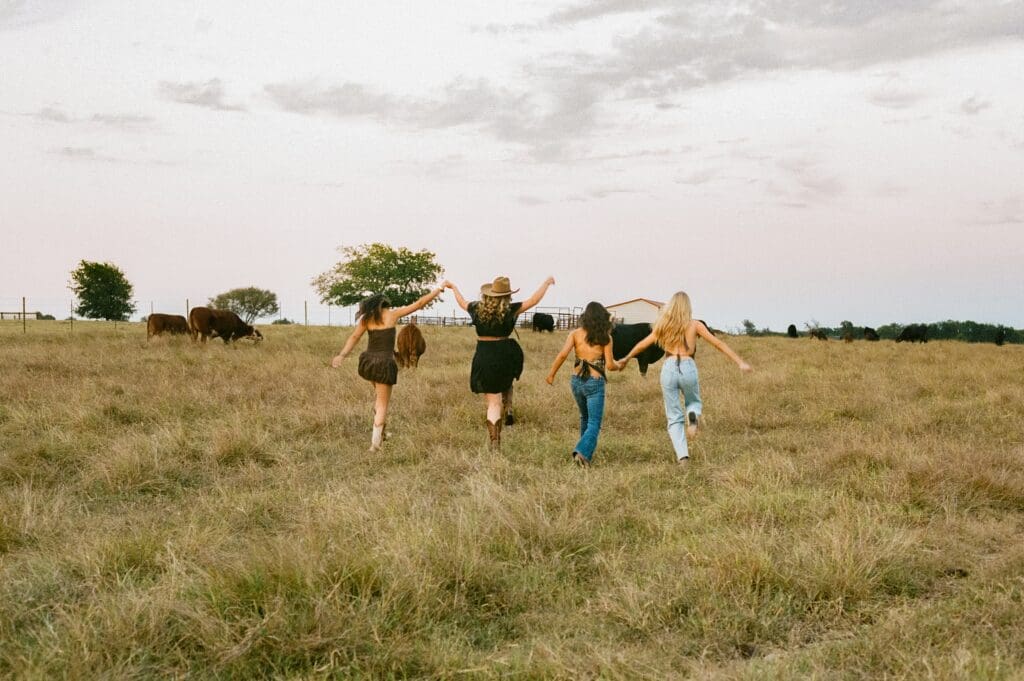 Austin senior photographer capturing senior rep team at a cattle ranch
